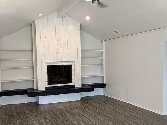 Main living room with gas fireplace.