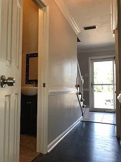 Downstairs hallway from living room to front door. Newly til