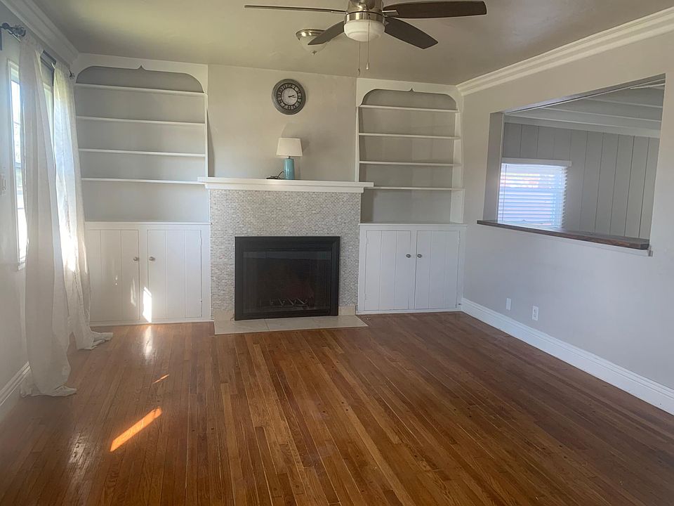Living Room with Original Wood Flooring and Fireplace