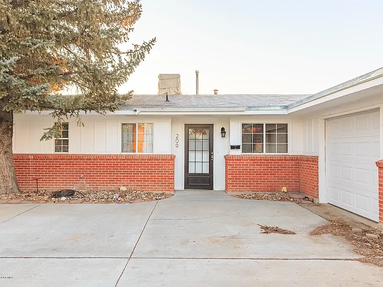 Front Door & single-car garage.