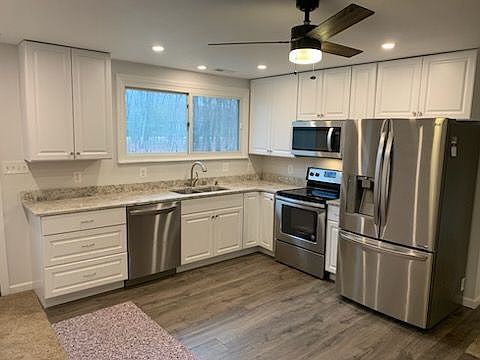 Freshly Remodeled Kitchen. Granite Counter, Stainless Steel Appliances, Recessed Lighting, Ceiling Fan Luxury Vinyl Planking Wood Floors