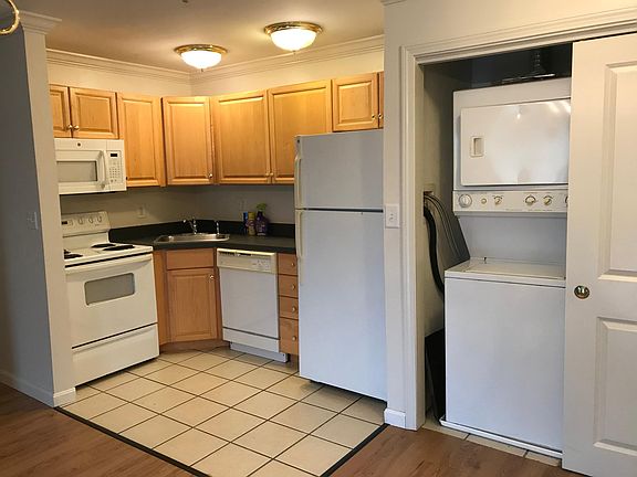 Kitchen with microwave, dishwasher and trash disposal. All appliances are included in the rent fee.