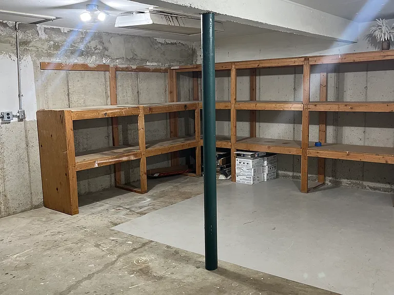 Downstairs storage room under garage