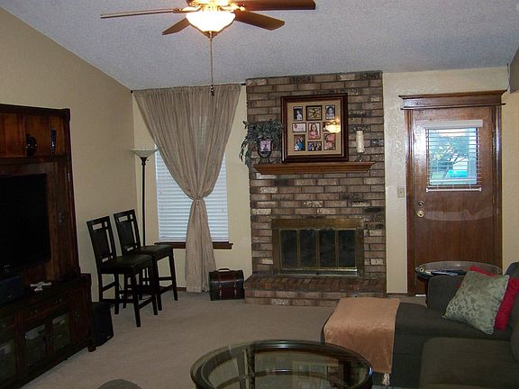 Living with vaulted ceiling and fireplace