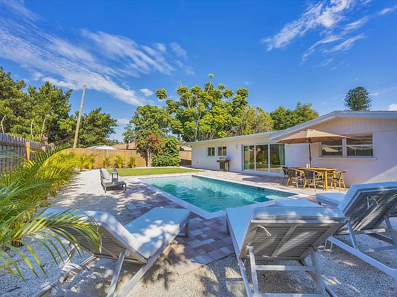 Large grassy backyard with new pool