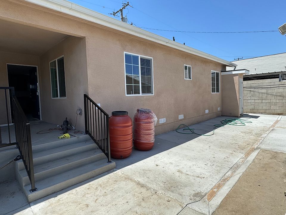 Front Entrance with wide stairs and handrails. Safety rail all around porch. All front area cemented for a clean and well drained area.
