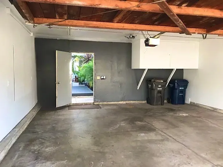 Two car garage with storage cabinet