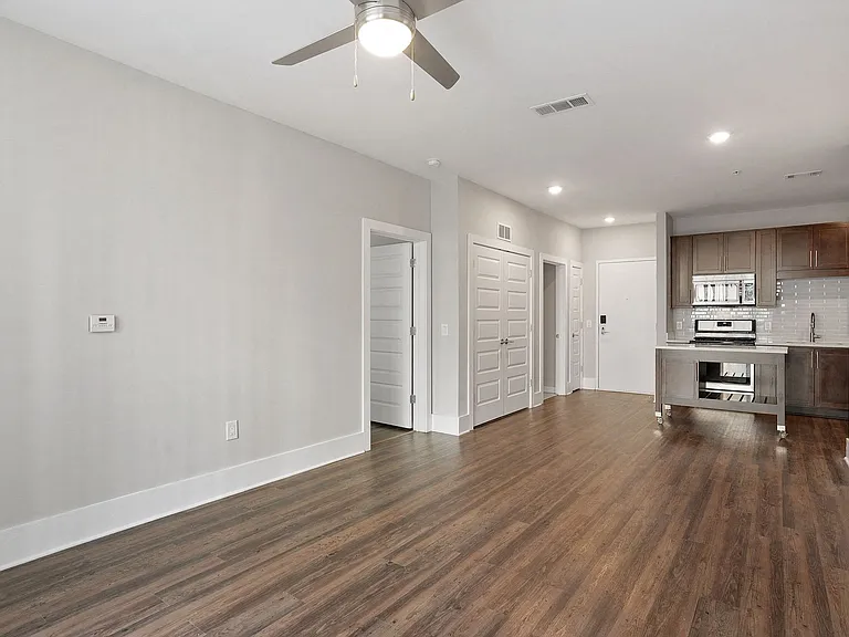 Open concept living, dining and kitchen spaces.