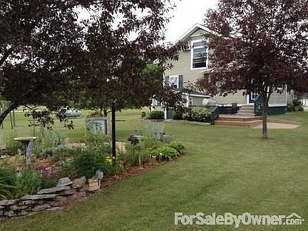 Back view of Home
						:
						Beautifully Landscaped with Herb Garden