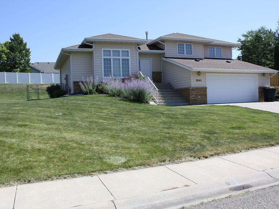 Front of house with 2-car garage.