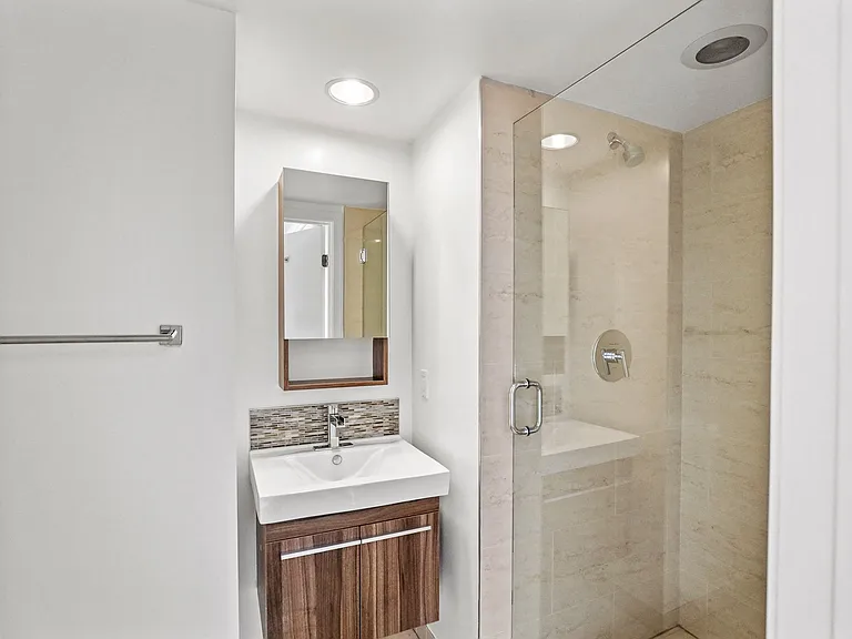 Bathrooms with Under Sink Storage and a Standup Showers