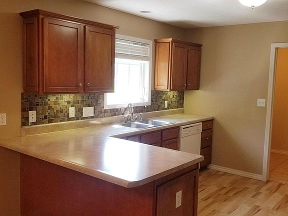 Kitchen w/plenty of counter prep space, nice back splash.