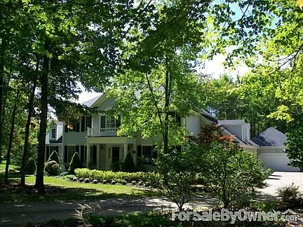 Facade facing street
						:
						Wooded front yard for extra privacy.