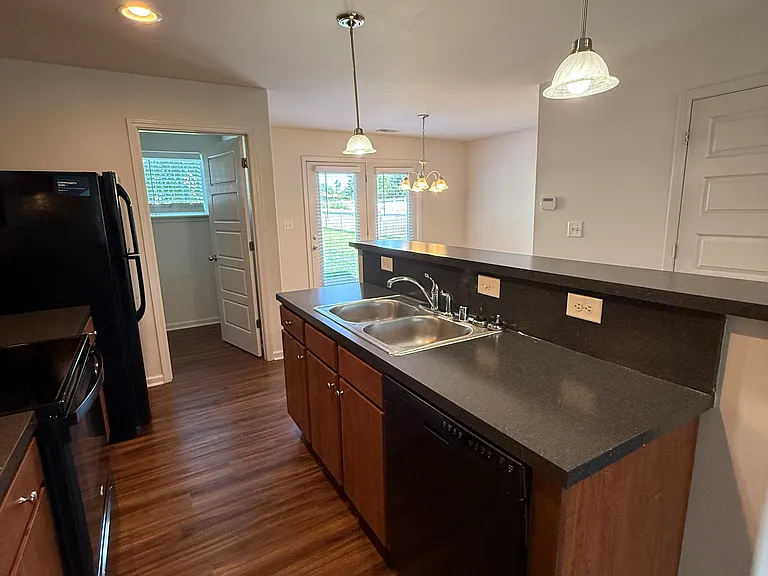 Photos of layout in similar unit. Overall finishes and fixtures may vary by home