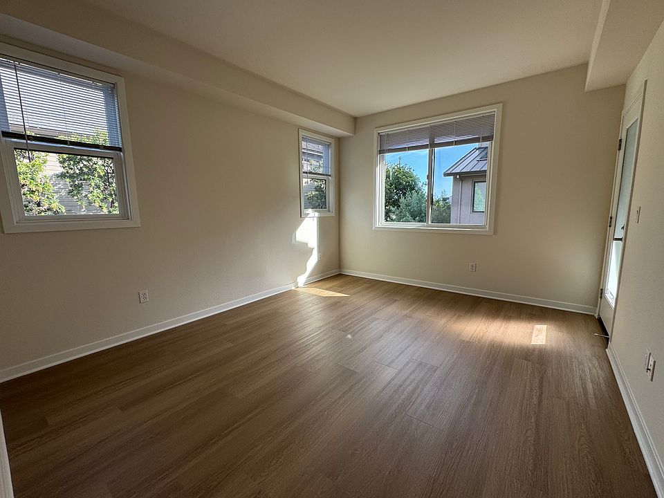 Primary bedroom with patio, full bathroom and walk in closet