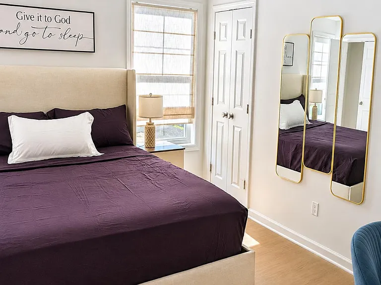 includes 2 double-door closets and wall mirrors.