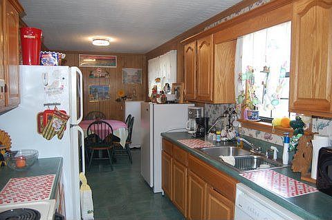 Kitchen with eat-in area, room for freezer! Overlooks garden/backyard.