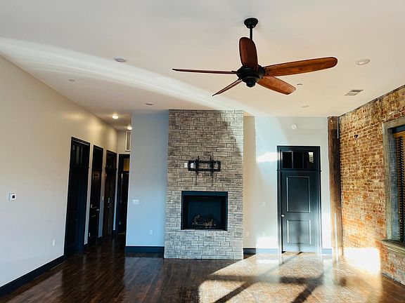 Living area. Guest bedroom, guest bathroom, laundry room to the left. Master bedroom, master bathroom, & closet to the right.