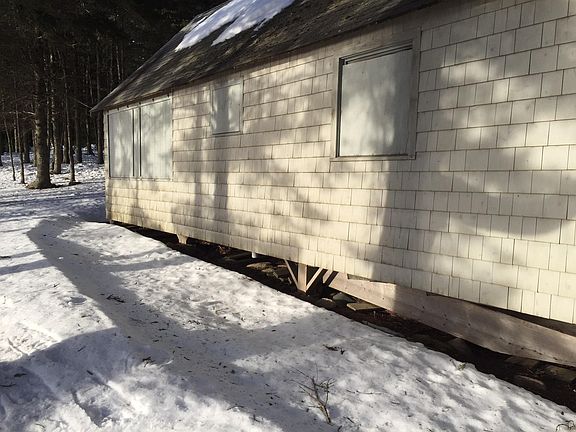 The cabin is bundled up for the winter.