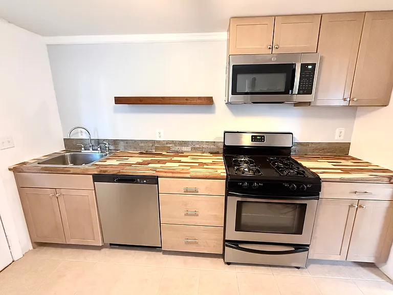 New kitchen cabinets with dishwasher and microwave