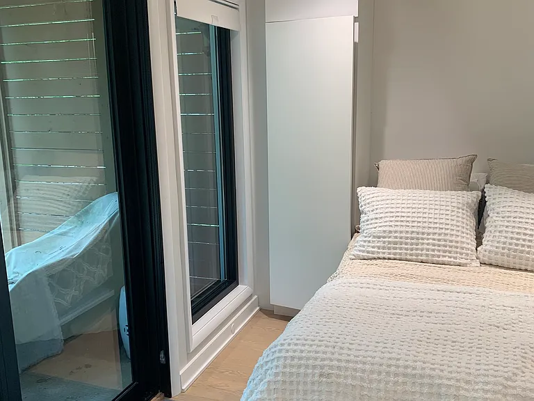 Custom Murphy bed with extra comfortable mattress. Enables built in flexibility to use this room as a guest room when needed or as an extra entertaining space (with Murphy bed folded up and seamlessly blending with the other custom cabinets to conceal).