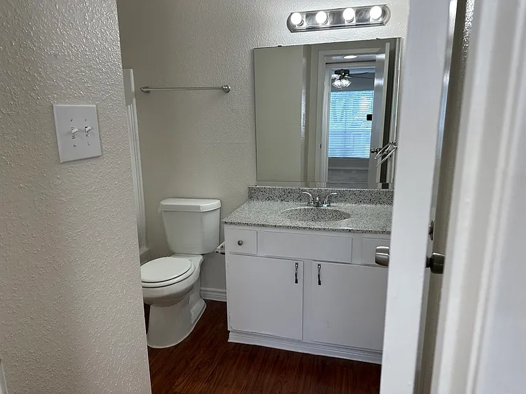 Modern bathroom with pristine vanity, sleek countertop, and elegant lighting, perfect for a refreshing start to your day. Modern bathroom with pristine vanity, sleek countertop, and elegant lighting, perfect for a refreshing start to your day.