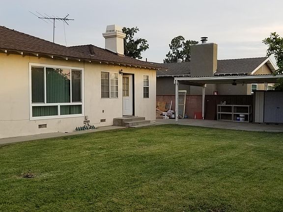 large backyard with shad storage