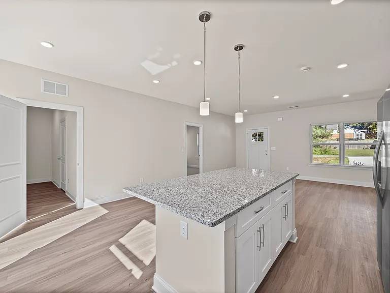 Access to the laundry room with shelves and storage