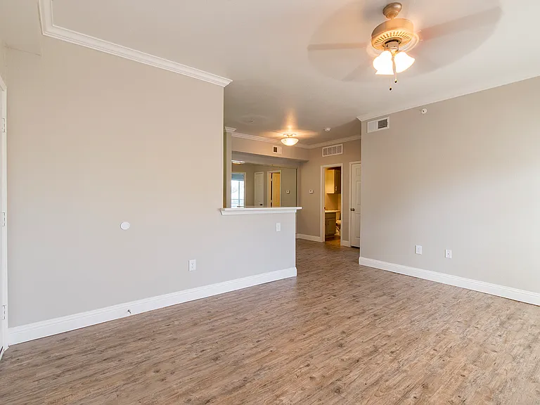Large open-concept living and dining area with upgraded flooring