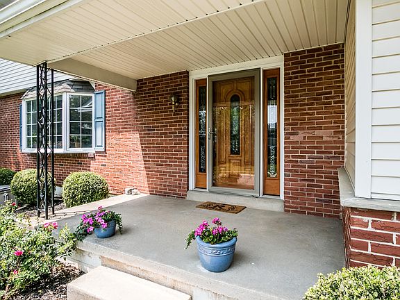 Spacious front porch for shaded relaxation