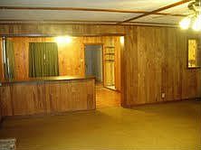 Living room looking over into dining room and kitchen area.