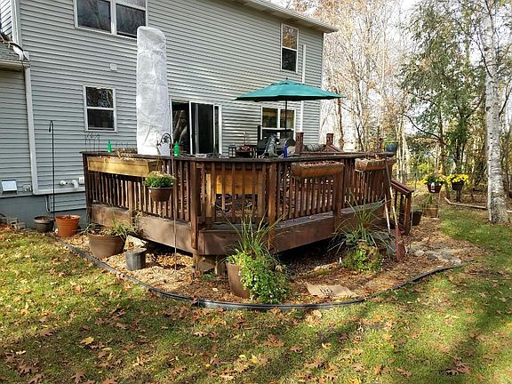 A two-tiered deck in back that offers a large area for a patio set, grilling and guests!