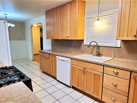 Dishwasher and country sink with updated faucet