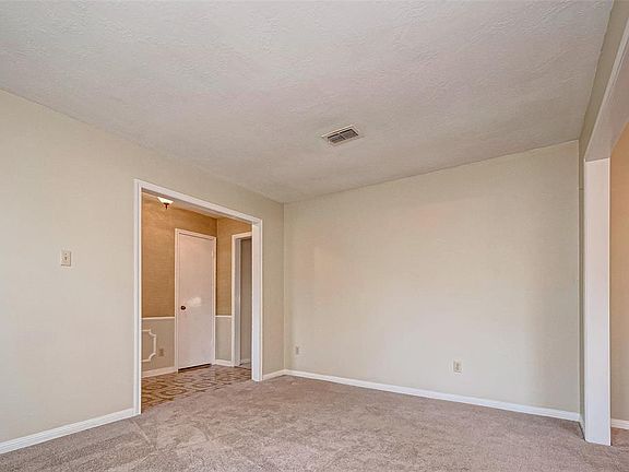 Alternate view of this living space with the traditional formal dining room adjoining to the right