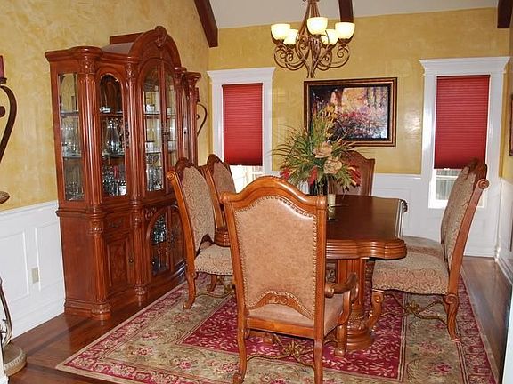 Formal Dining features inlaid wood floors