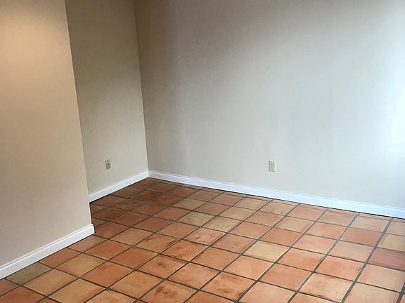 Office desk nook and additional living room area for separate space