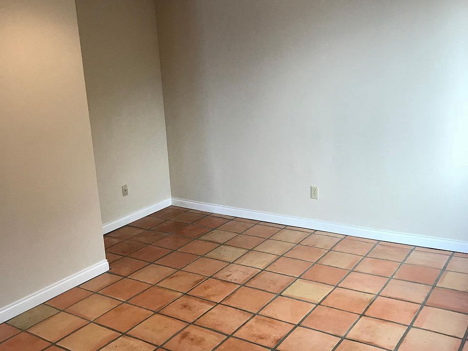 Office desk nook and additional living room area for separate space