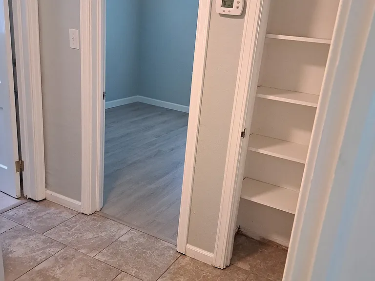 Hallway between guest bedroom 1 & 2, and the guest bathroom on the left