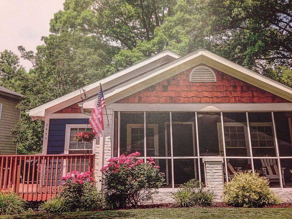 Traditional one story Craftsman style home with screened fro