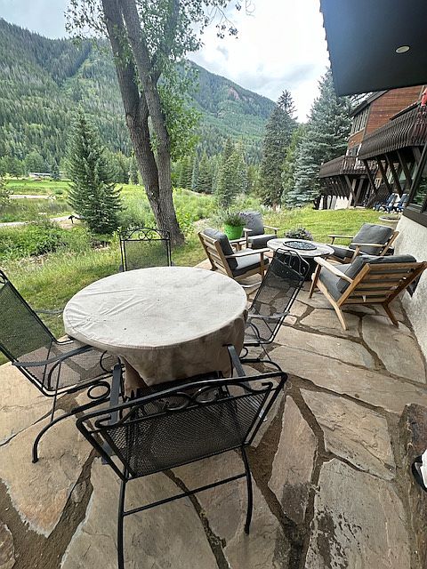 Lower patio accessible from bedrooms. Only table will be out for winter.