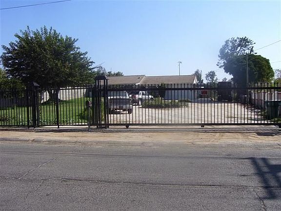 view from street, home has secure yard