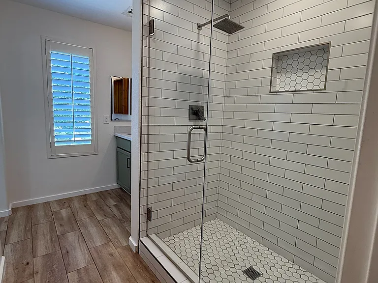 Private en-suite with dual vanities, designer finishes, and a spacious layout.