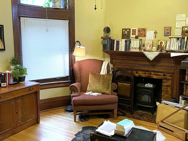 Original 1888 hand-carved oak fireplace surround.