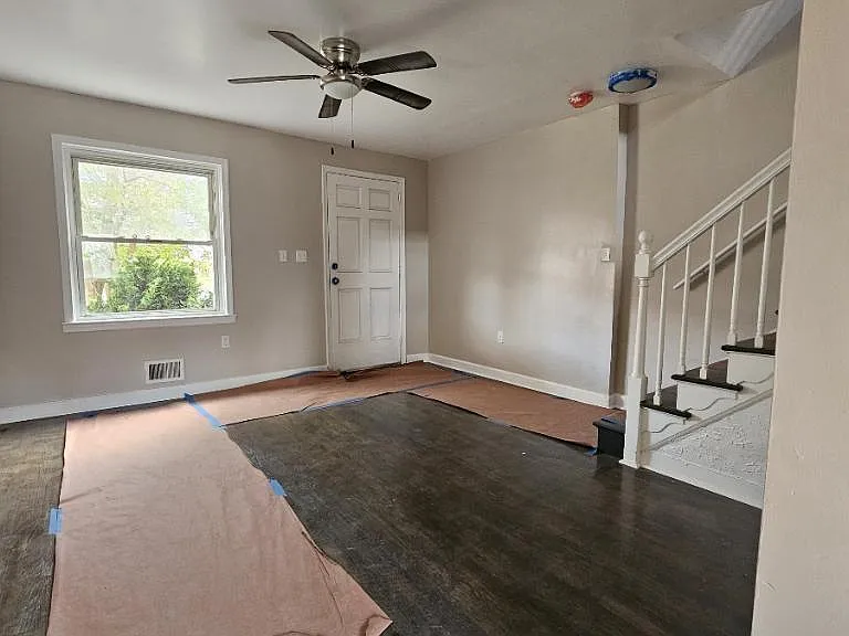Front entrance from the dining/kitchen atea. 
Steps leading to upstairs.