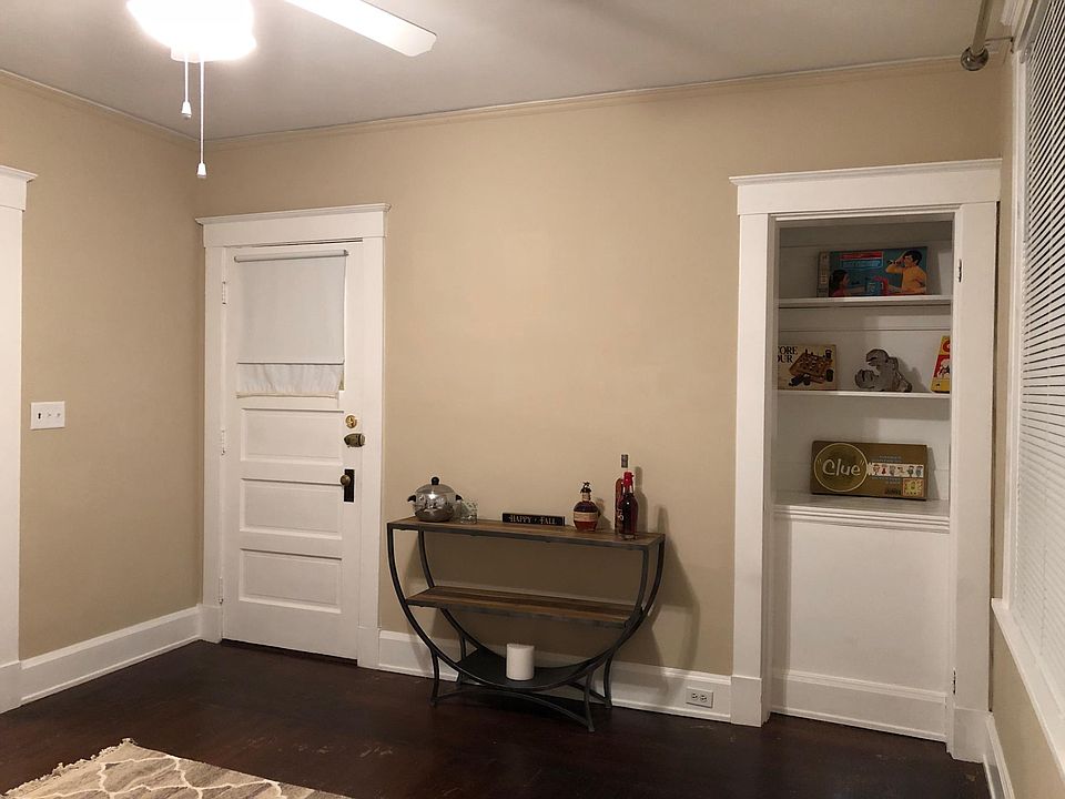 Living Room - door is the entrance to the apartment. To the right is the private covered porch.