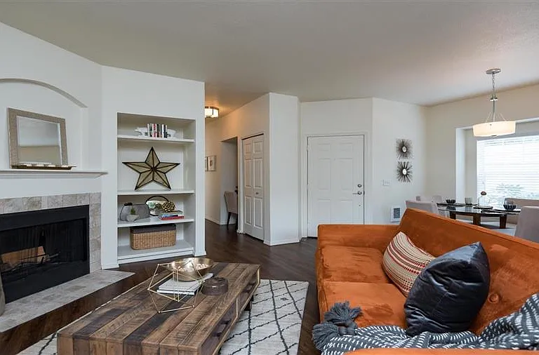 Village at Main Street | Living Room with Built In Shelving and Fireplace