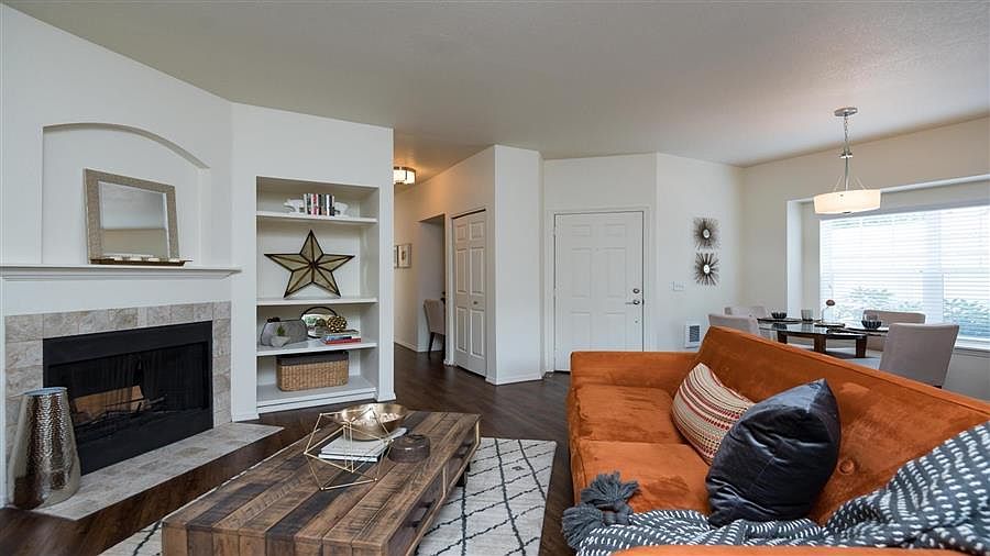 Village at Main Street | Living Room with Built In Shelving and Fireplace