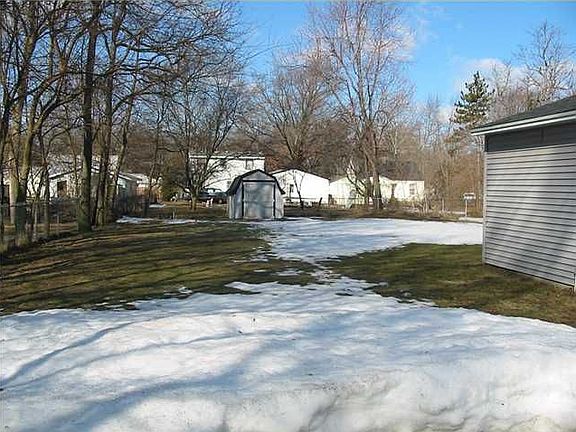 Storage Shed in Fenced Backyard