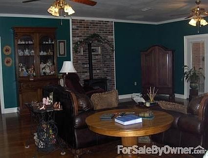 Living and Back Entry
						:
						Living Area with Double Entry Door,windows,wood floors & Vermont Casting Stove