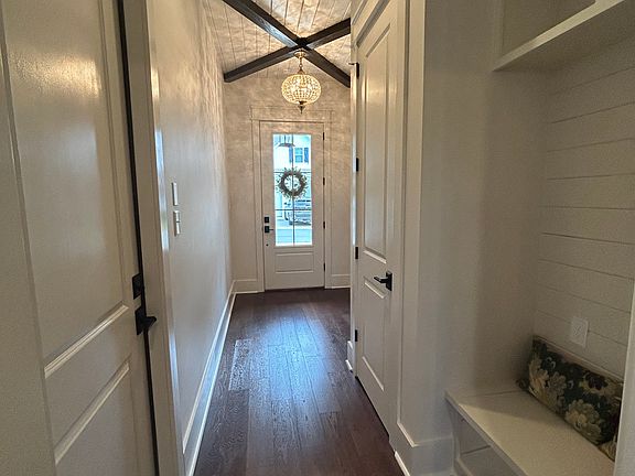 Foyer includes a coat closet and built-in bench seating